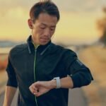 Best Smartwatches for Running in 2026: 5 Picks with Accurate GPS Runner checking one of the best smartwatches for running mid-run