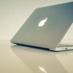 MacBook Air vs MacBook Pro in 2026: Which Should You Actually Buy? MacBook Air vs MacBook Pro 2026 comparison on a desk