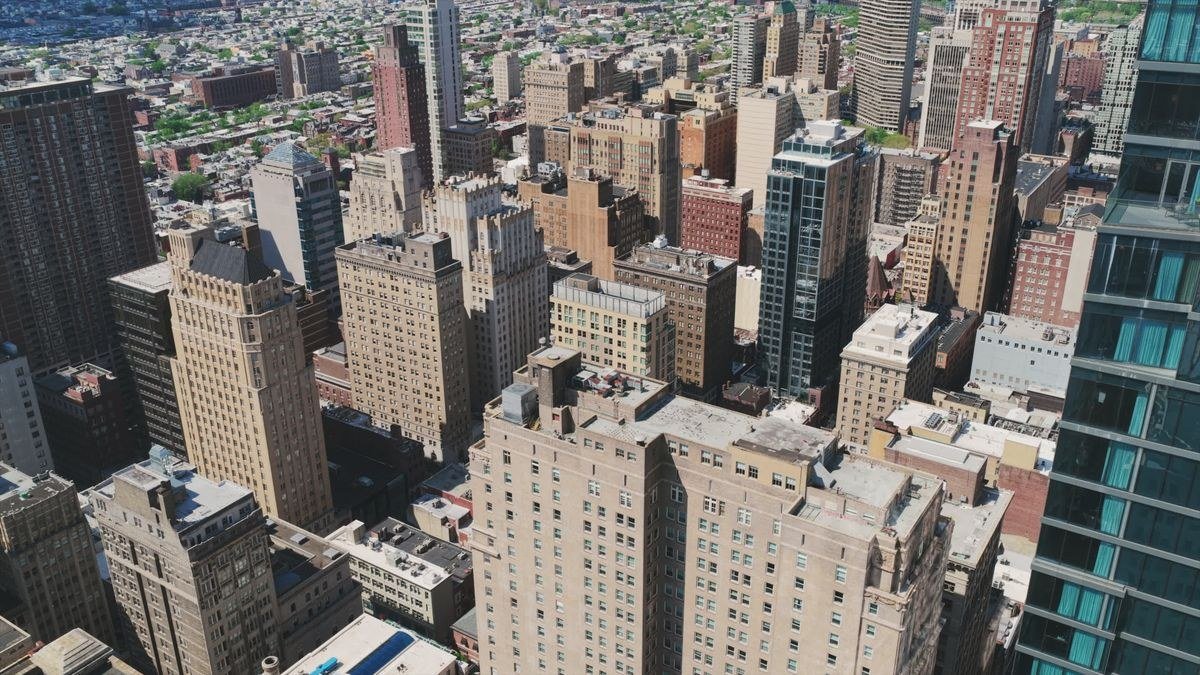 US drone laws 2026 beginner guide — drone flying legally over a city