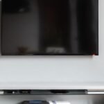 Best TV wall mounts 2026 with a flat-screen TV mounted on a living room wall