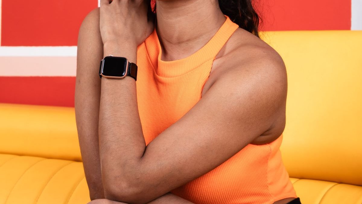 Best tech gifts for women 2026 arranged on a table with smartwatch earbuds and kindle