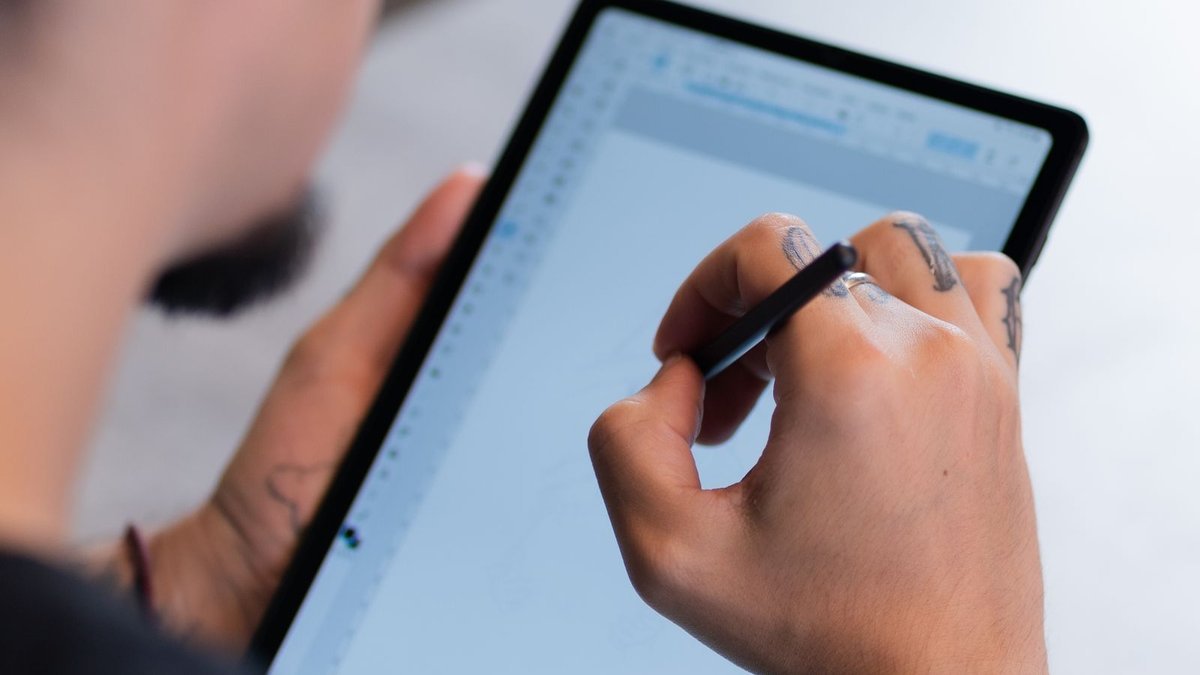 Using a stylus on a touchscreen, one of the best 2 in 1 laptops 2026