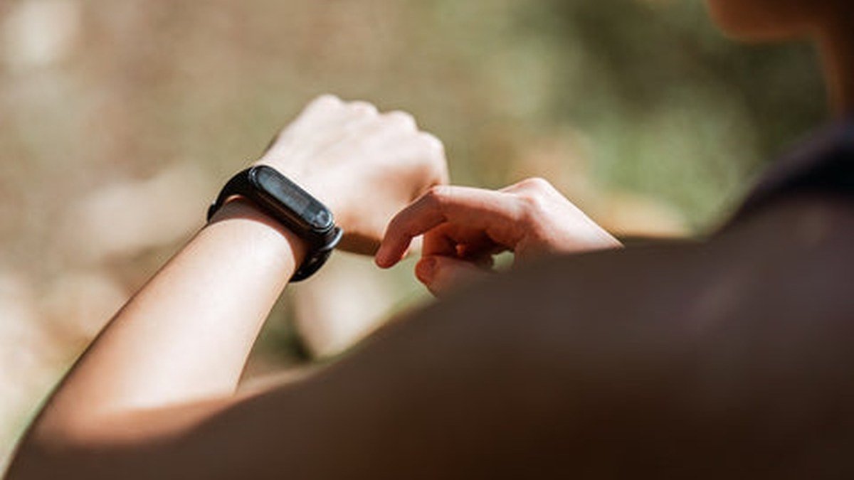 Person wearing one of the best budget smartwatches under $100 in 2026