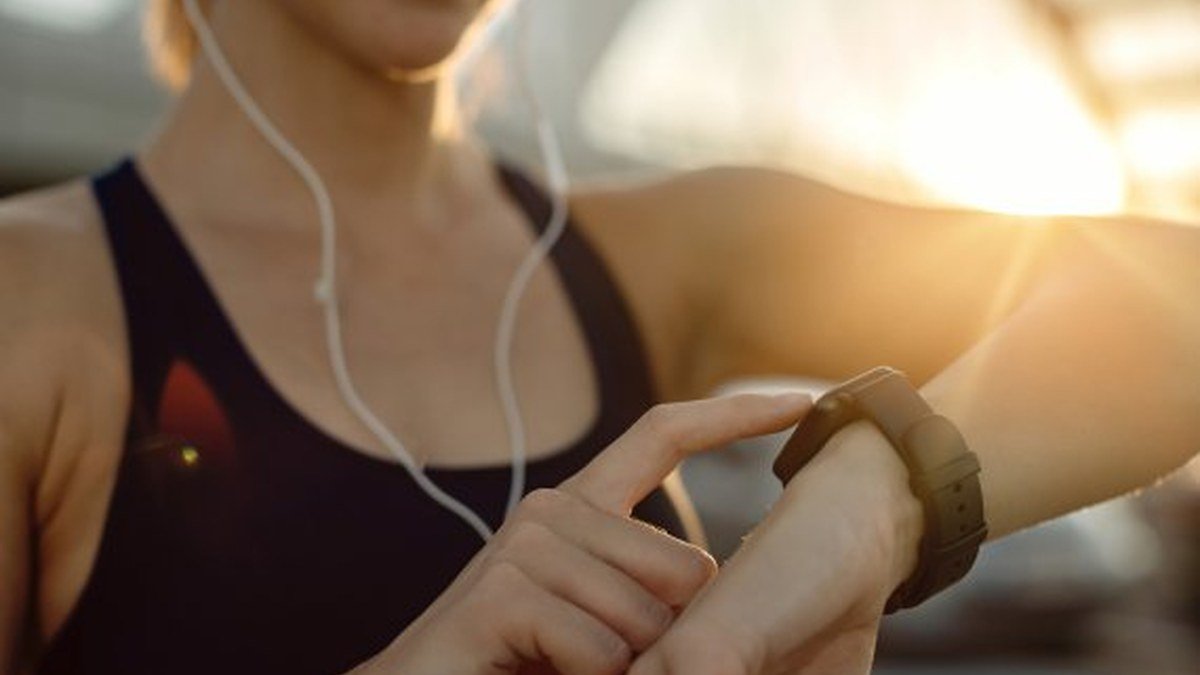 Person training outdoors with a fitness wearable, best fitness trackers