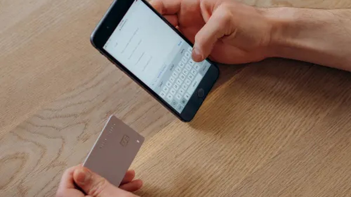 Slim magnetic card holder wallet for iPhone in hand