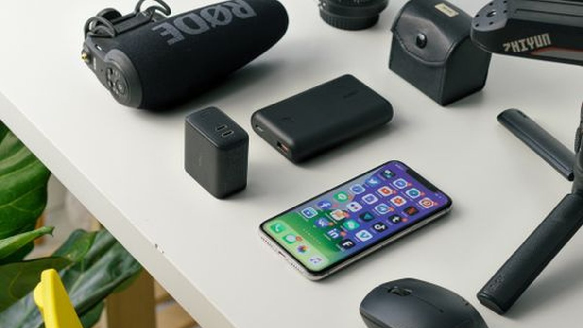 Budget tech gifts under 100 dollars 2026 charger power bank webcam on desk