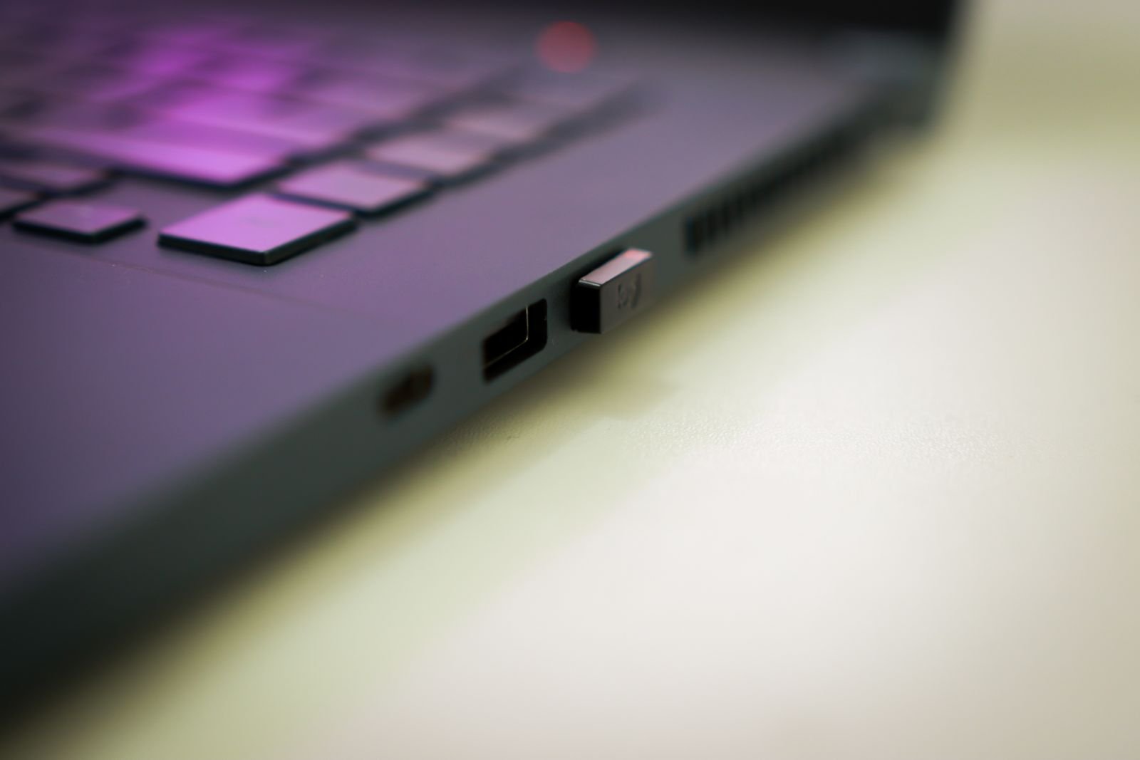 Close-up of laptop charging port — proper charging habits improve laptop battery life