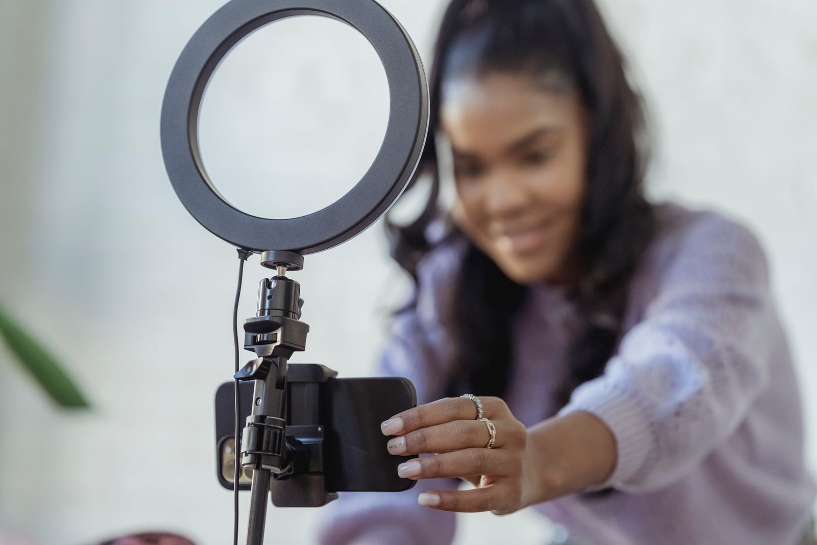 Ring light illuminating a creator filming a video